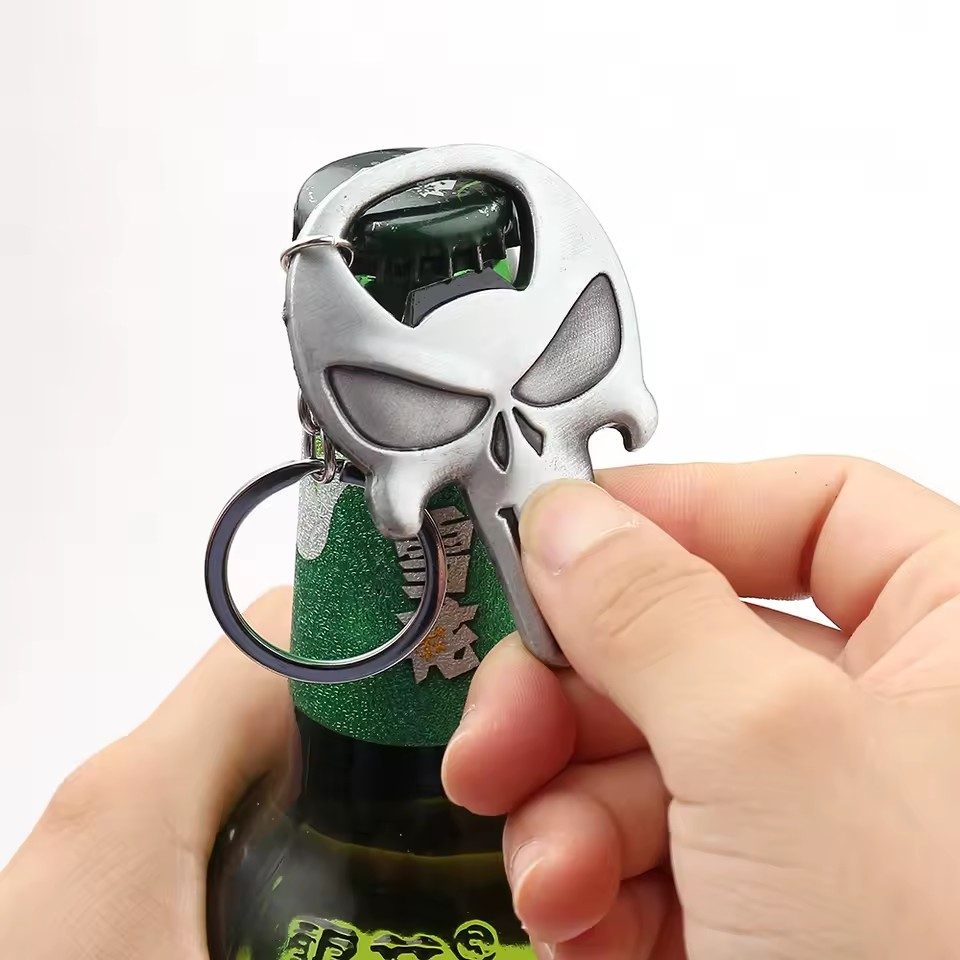 The Punisher key holder being used to open a bottle.