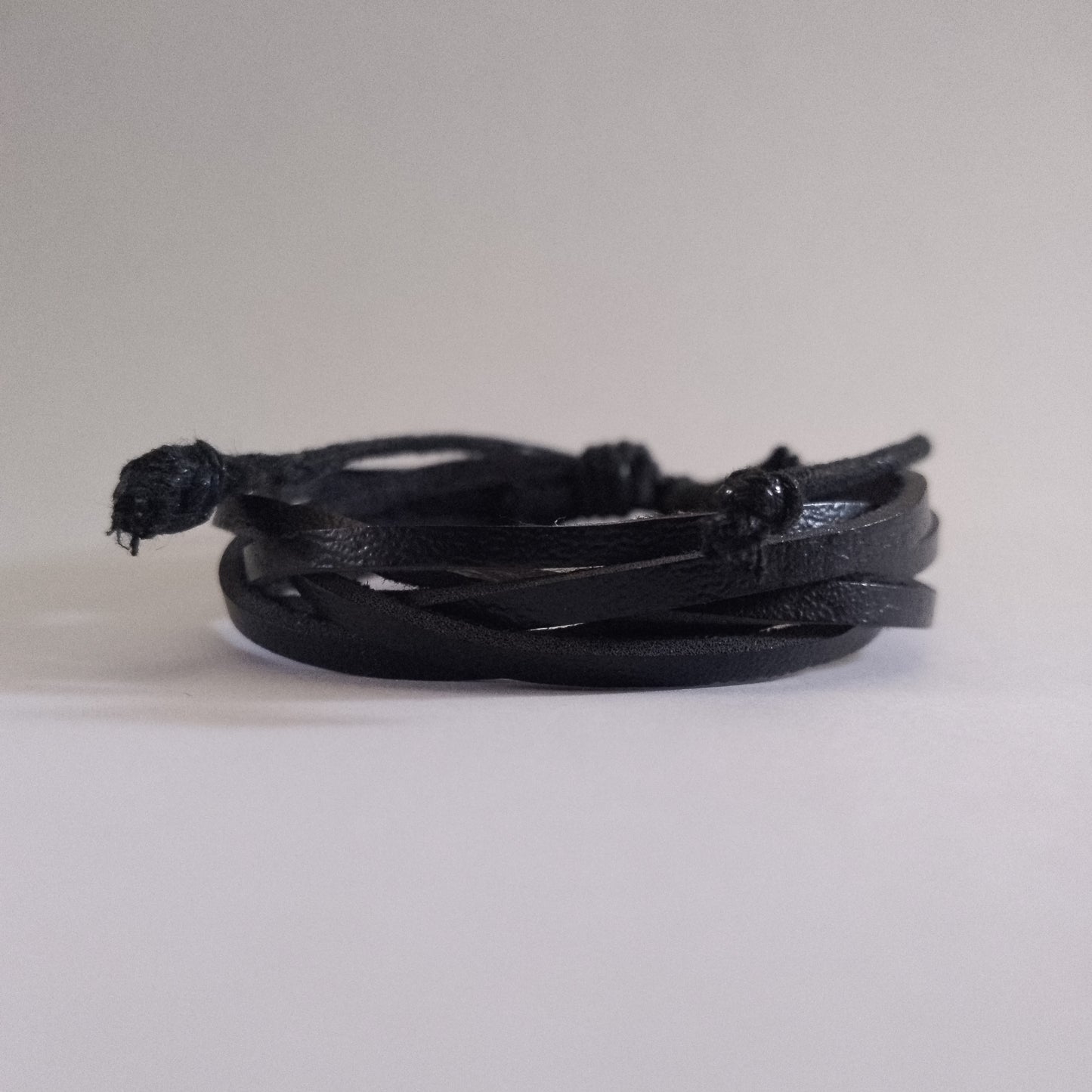 Elegant black corded leather bracelet, durable Kenyan handcrafted accessory
