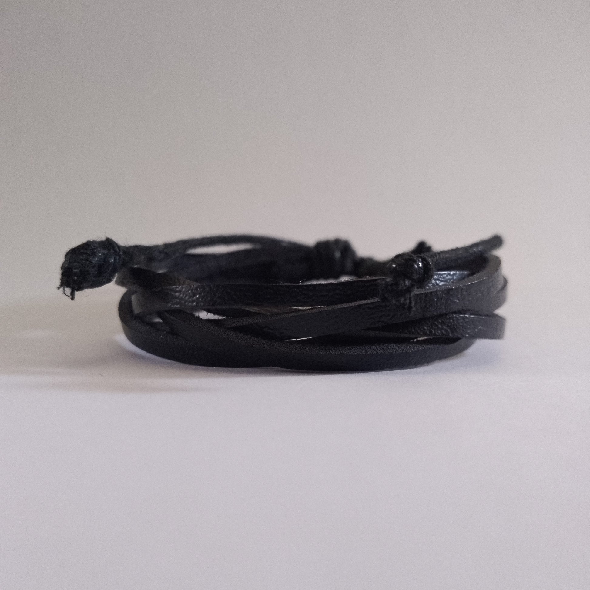 Elegant black corded leather bracelet, durable Kenyan handcrafted accessory