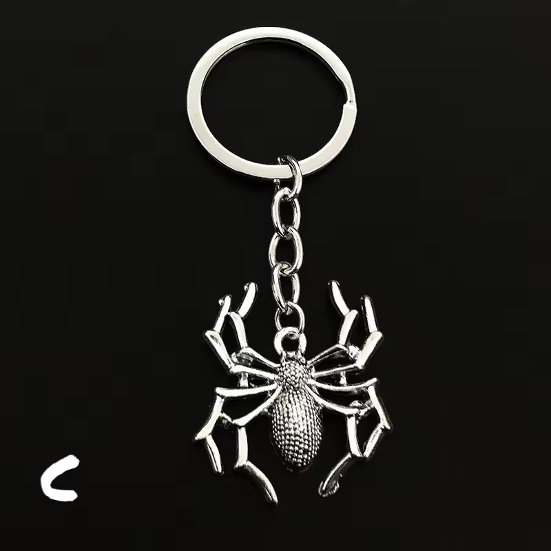 Spider silver metal key holder with a spiderman minifigure